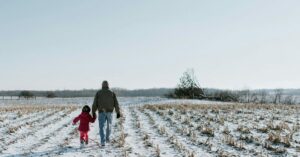 Man walking with young girl.