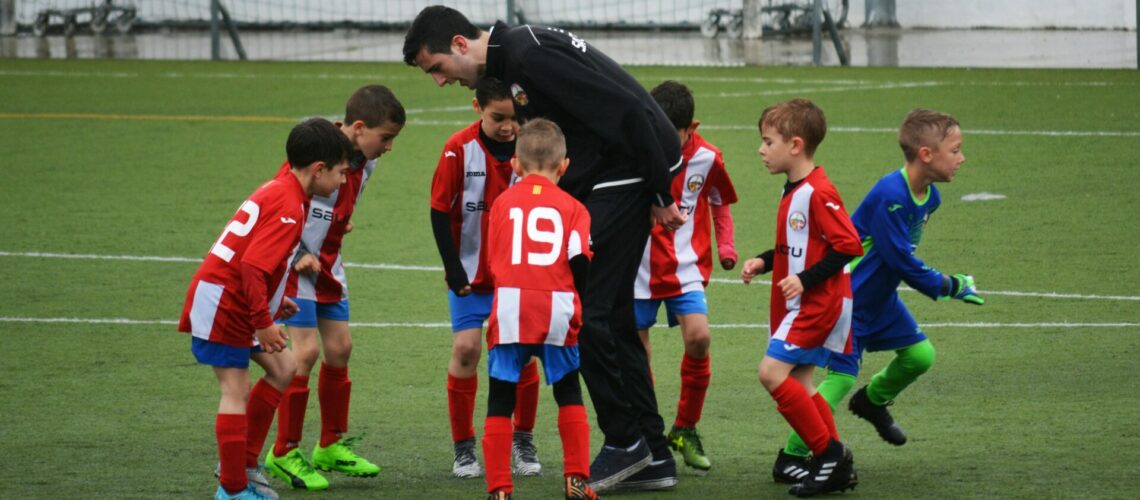 coach with a youth soccer team