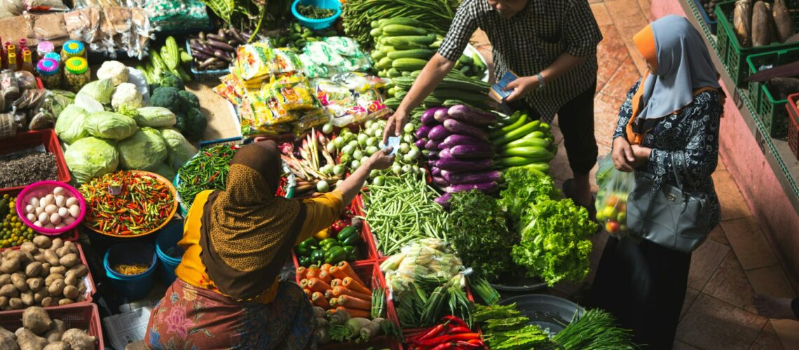 international food maket vegetable section with people shopping